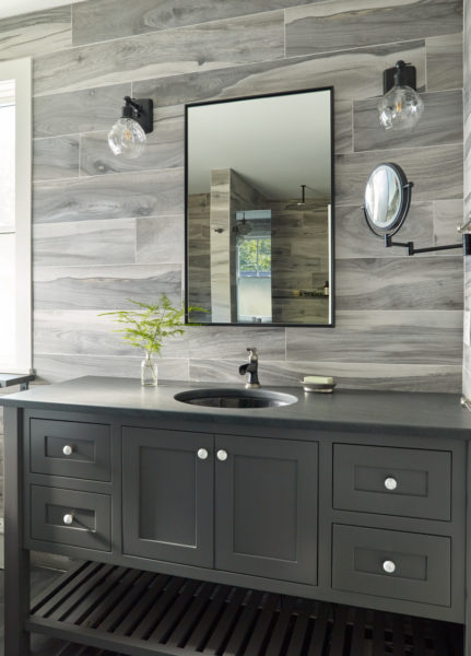 Custom vanity in gray, inset sink with center mounted waterfall faucet