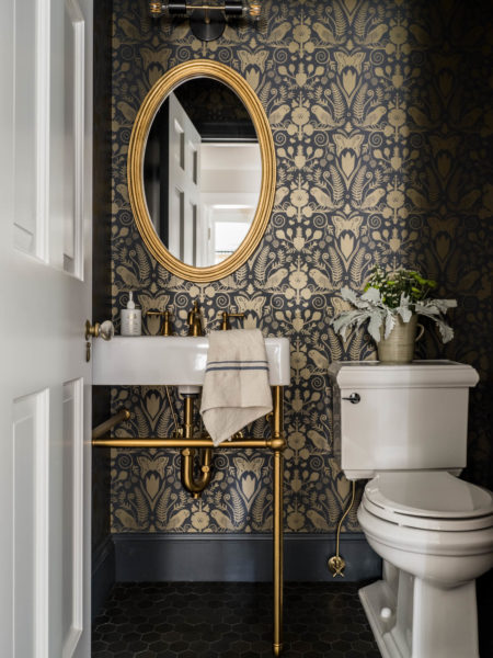 Gold detailed bathroom with statement wallpaper