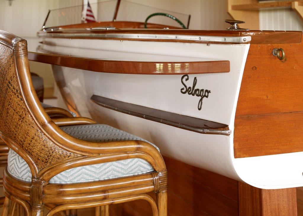 Custom nautical bar that features a repurposed boat.