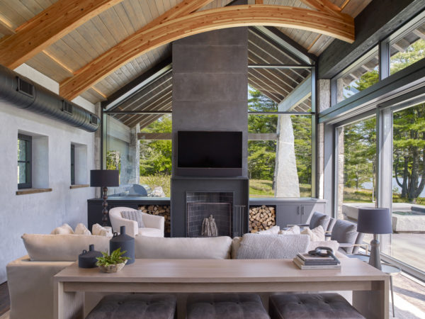 Stoneview Spa living room with stone fireplace hearth and exposed beams