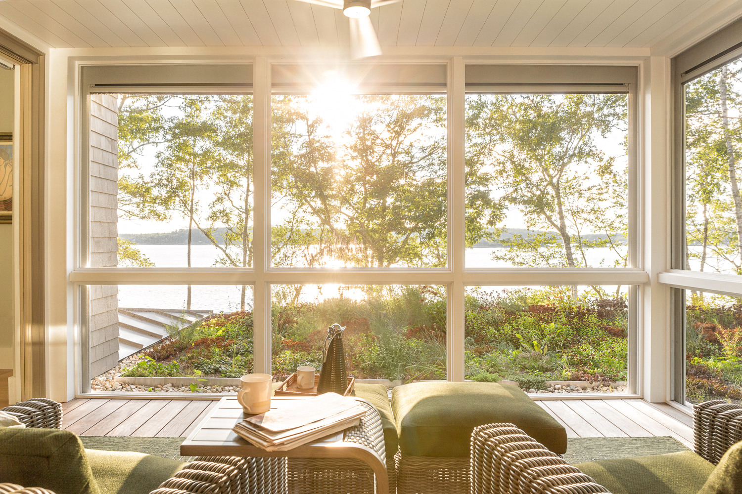Screen porch off the primary bedroom overlooking the green roof with views to the ocean