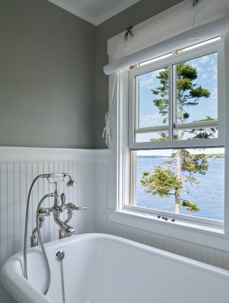 Vintage style bathtub with large window for enjoying the ocean view at Twin Cove.