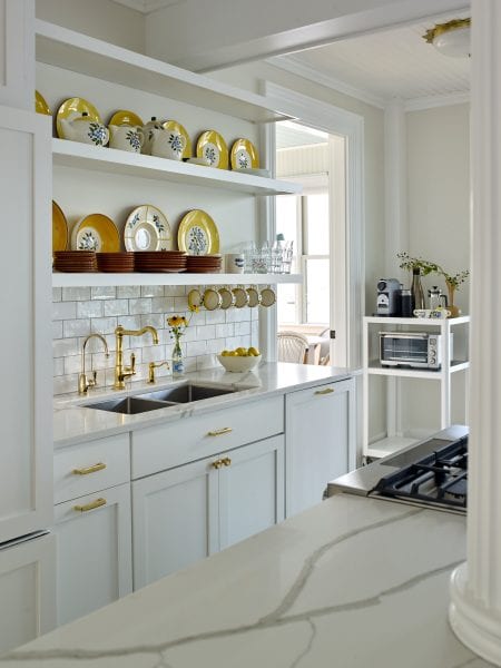 Gold and marble details continue throughout this coastal Maine kitchen.