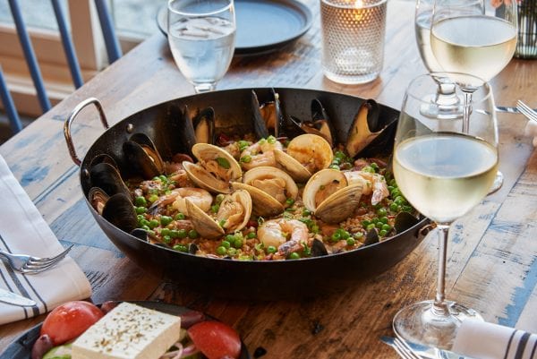 Seafood dinner with wine on the rustic tables at Water Street