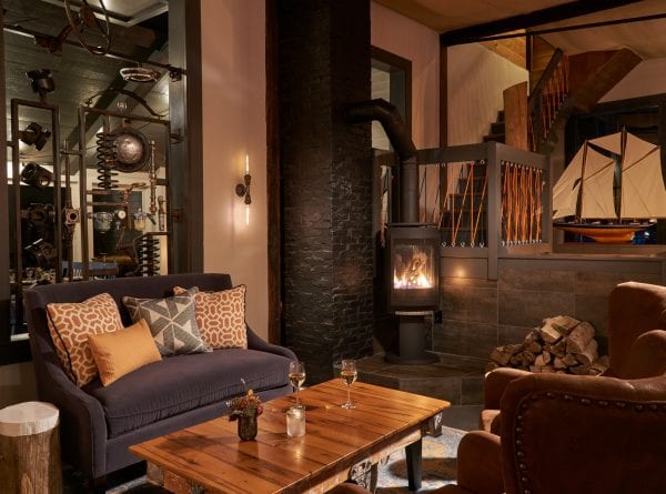 Cozy lounge area at Water Street with unique fireplace.