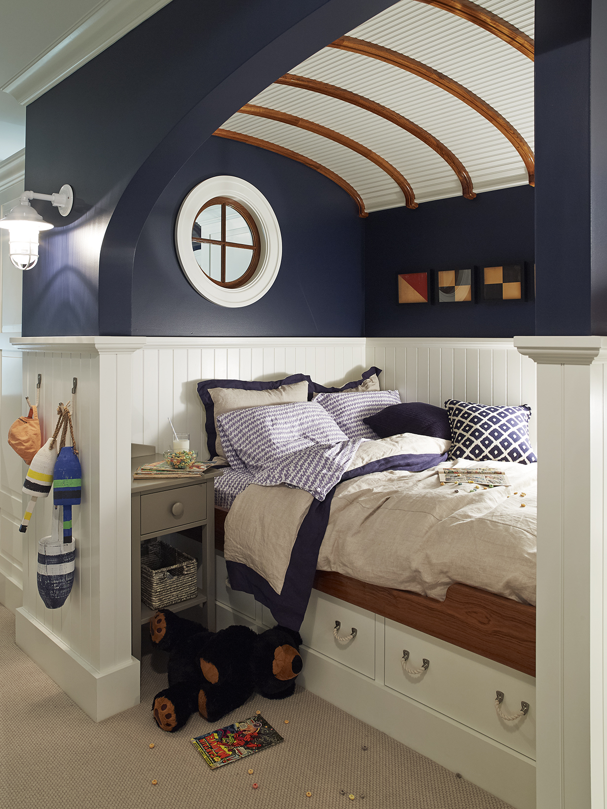 Nautical inspired room with navy blue and shiplap ceiling