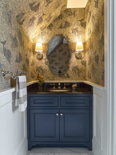 Fish wallpaper in this nautical inspired powder room