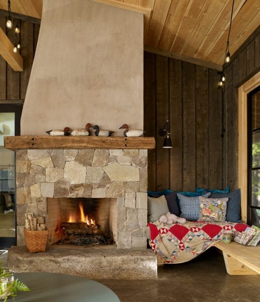 Comfy living area with large stone fireplace at Cozy Bear Cabin