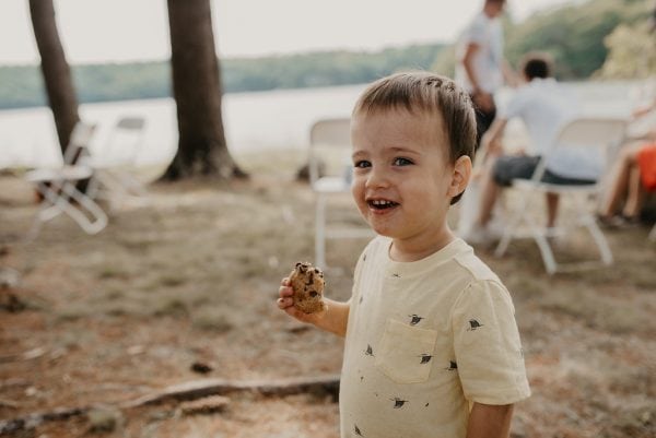 Cute kid and delicious cookies at Knickerbocker Group family-friendly lobster bake