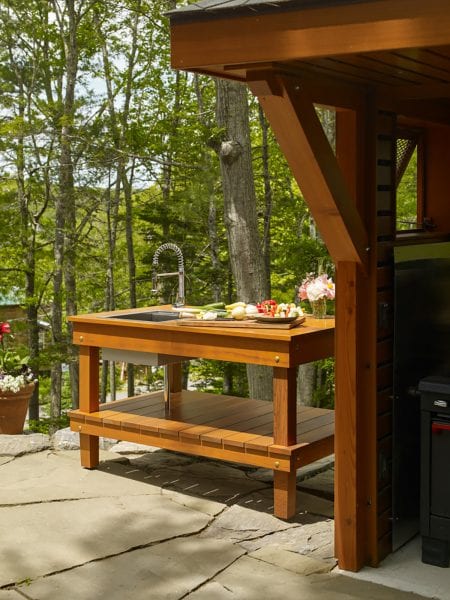 Outdoor dining area with sink at Mt. Pisgah property