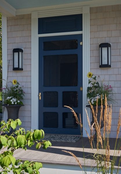 Welcoming entryway with coastal theme and floral accents.
