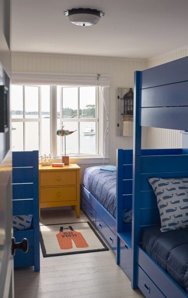 Bunked up bedroom with cute fishing theme that overlooks the ocean in Maine.