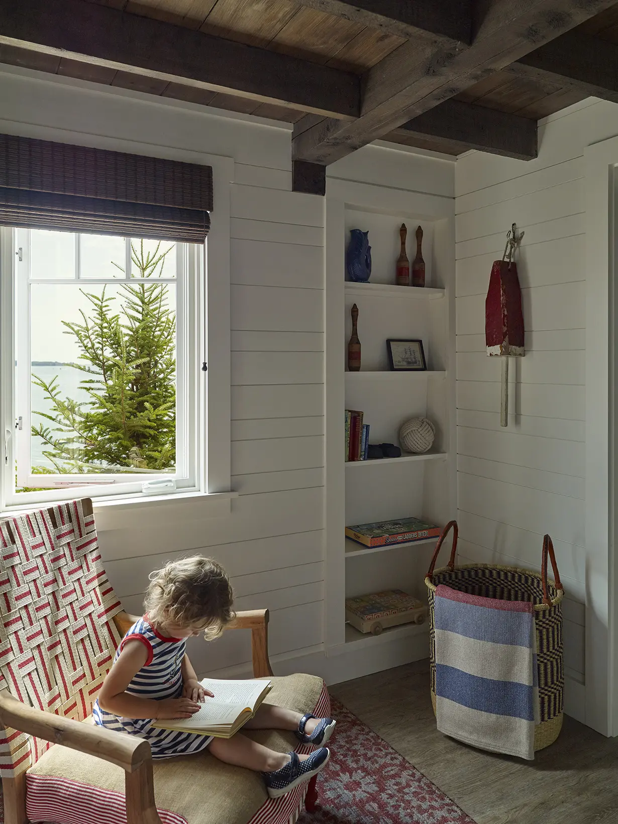 Child enjoying the reading nook at Basque in the Sun