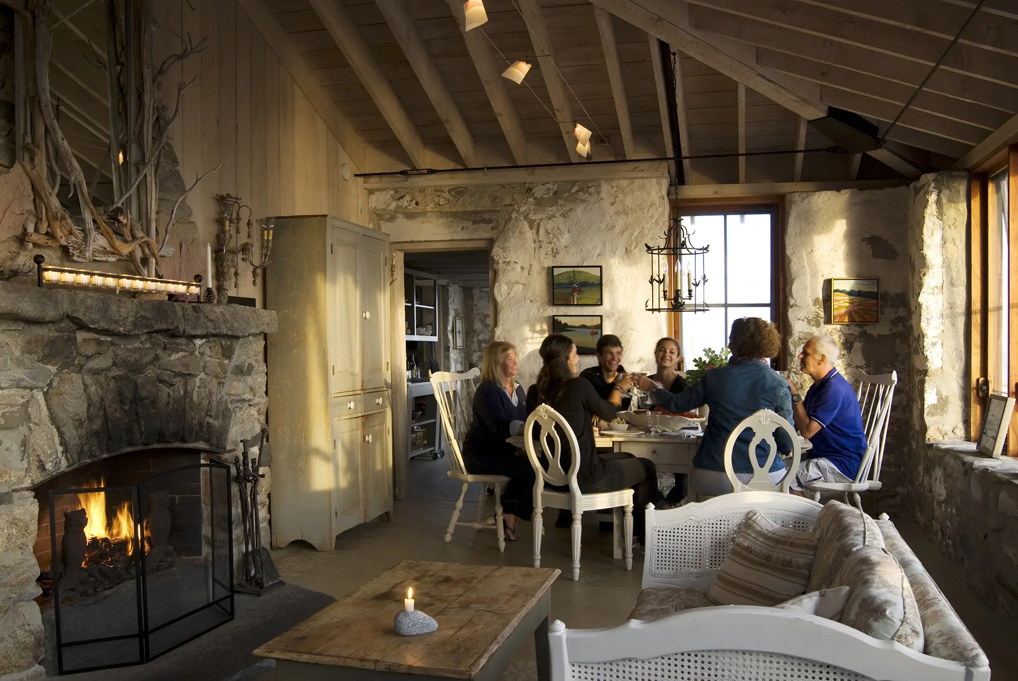 Family enjoying a meal at the dining table at Hunting Island Cottage