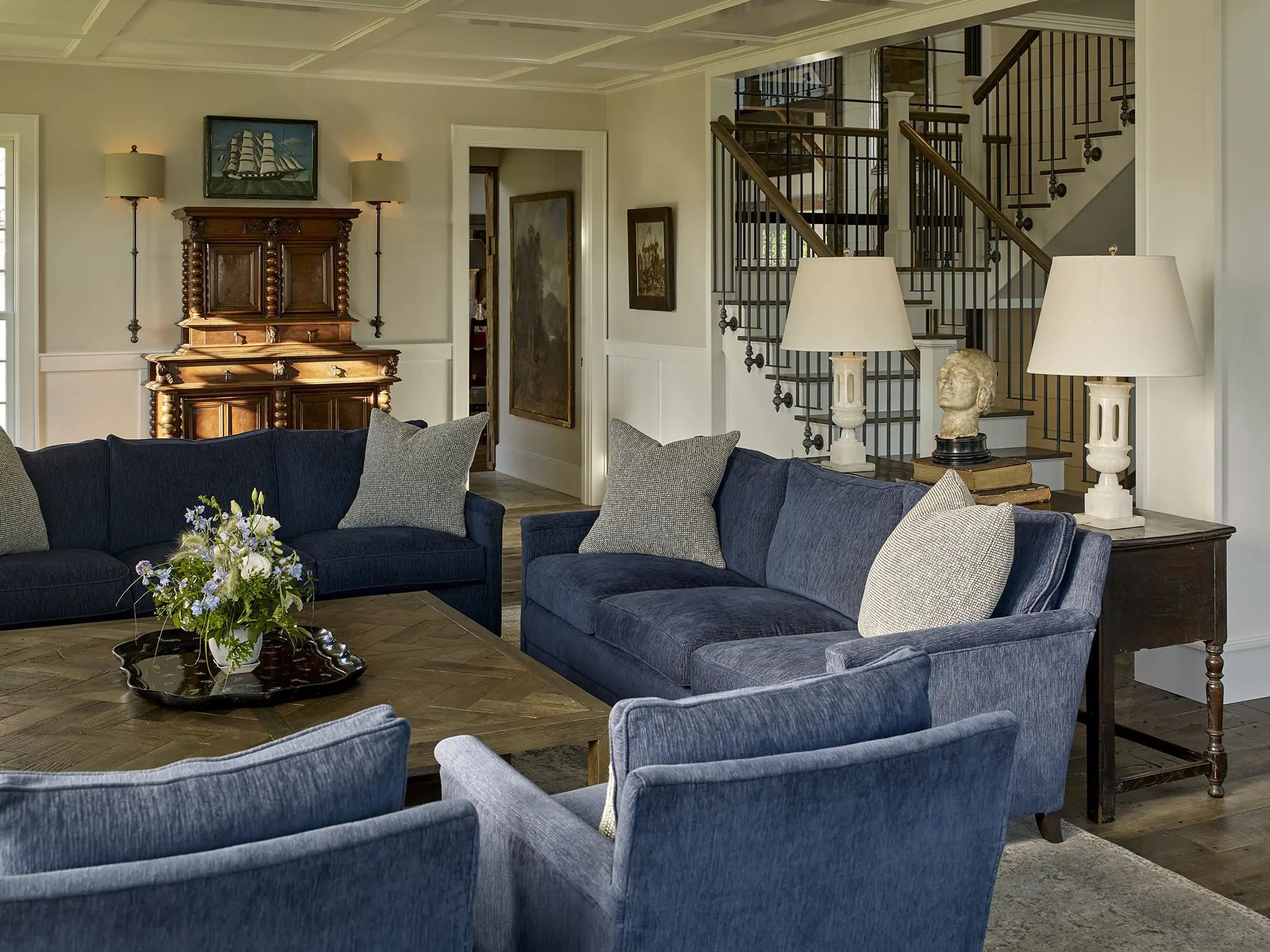 Light filled living area featuring soft blue furnishings