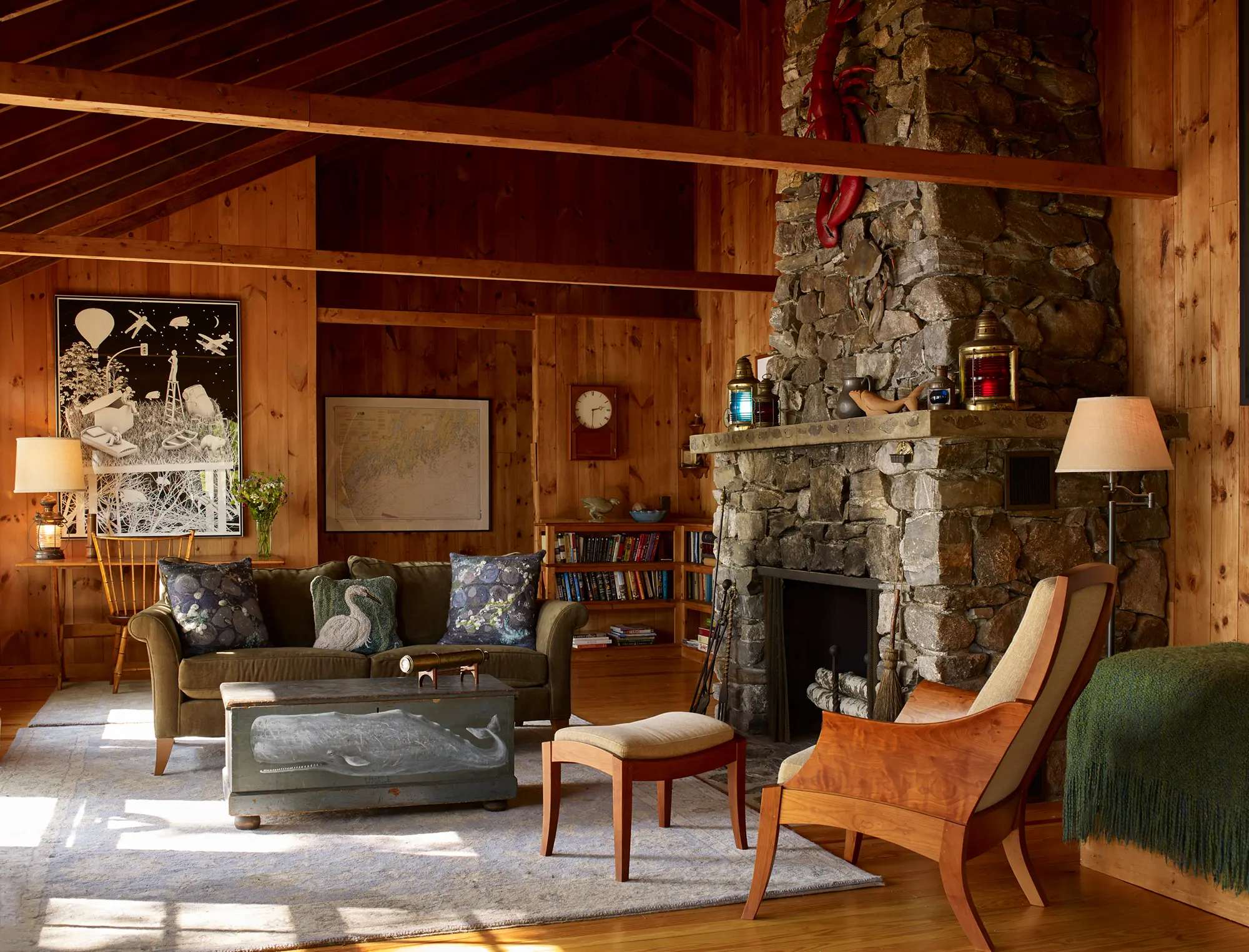 Large stone fireplace in the living area at Little Acorn Cottage