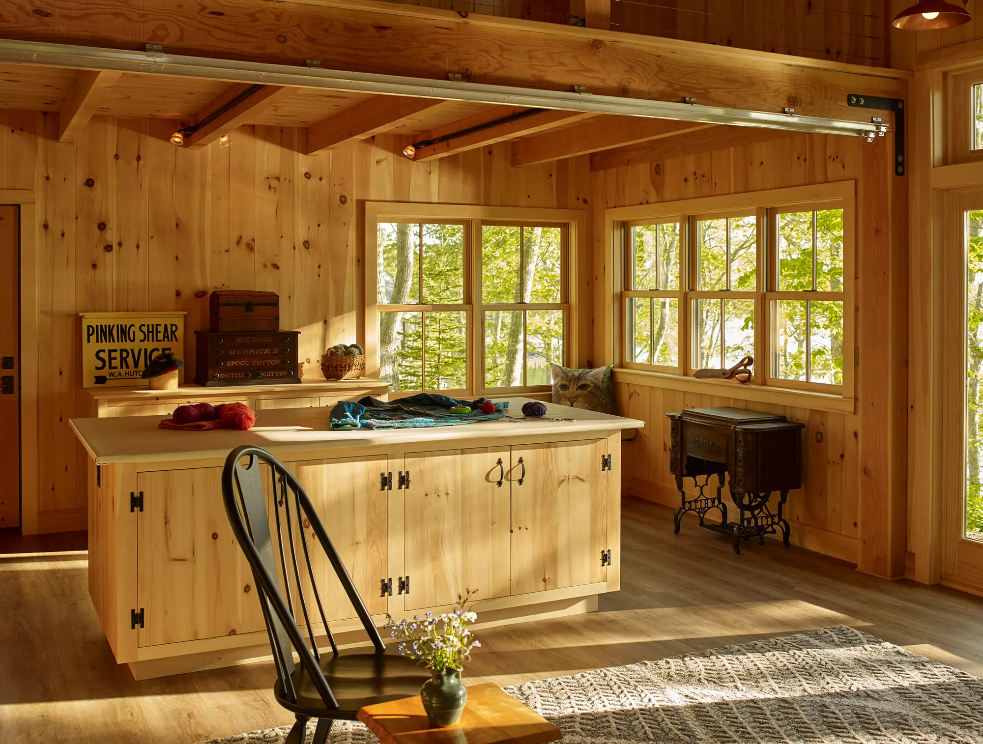 Spacious crafting area with large multipurpose island at Little Acorn Cottage